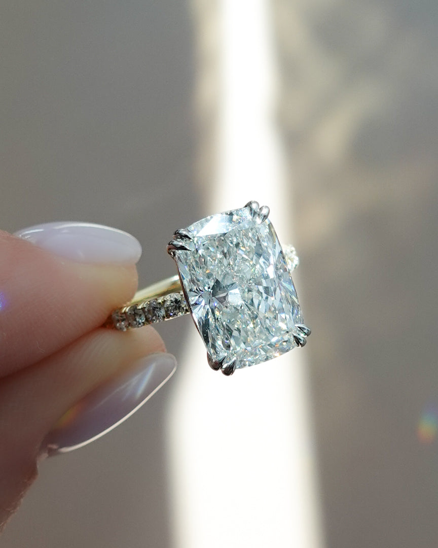 A Diamond Dilemma: Elongated Cushion Cut vs. Oval Cut