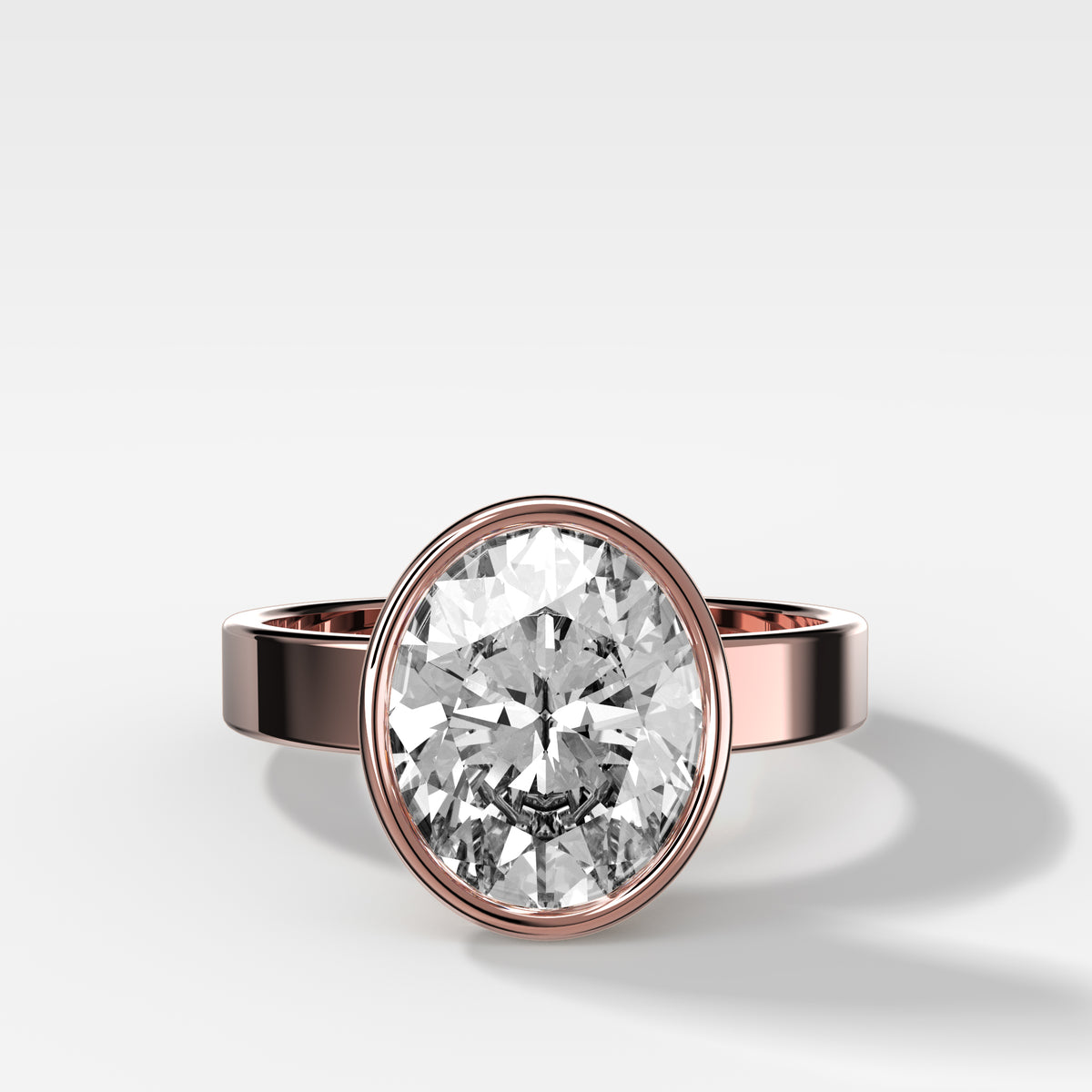 Finest Bezel Set Engagement Ring With Oval Cut Diamond