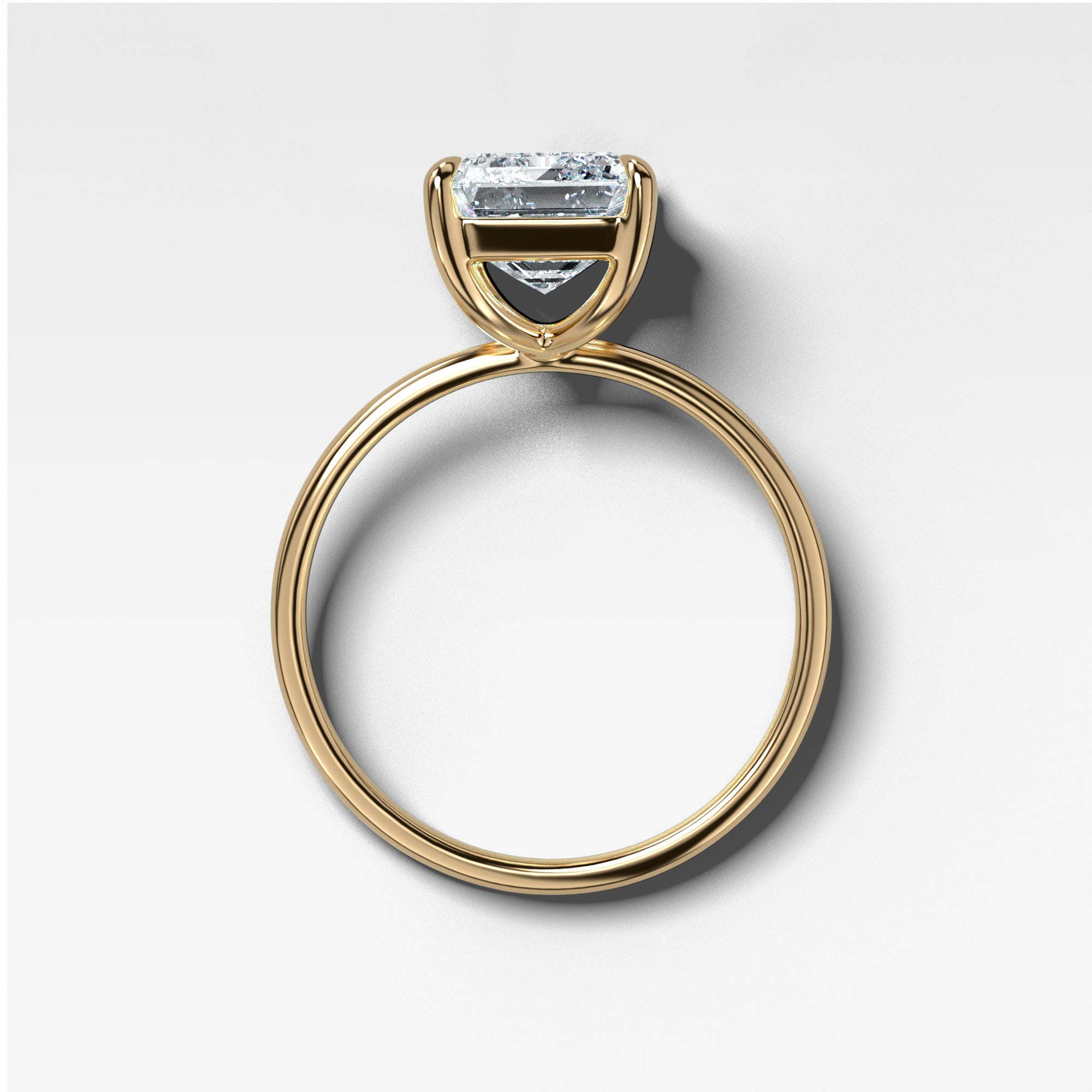 Thin + Simple Solitaire With Emerald Cut by Good Stone in Yellow Gold