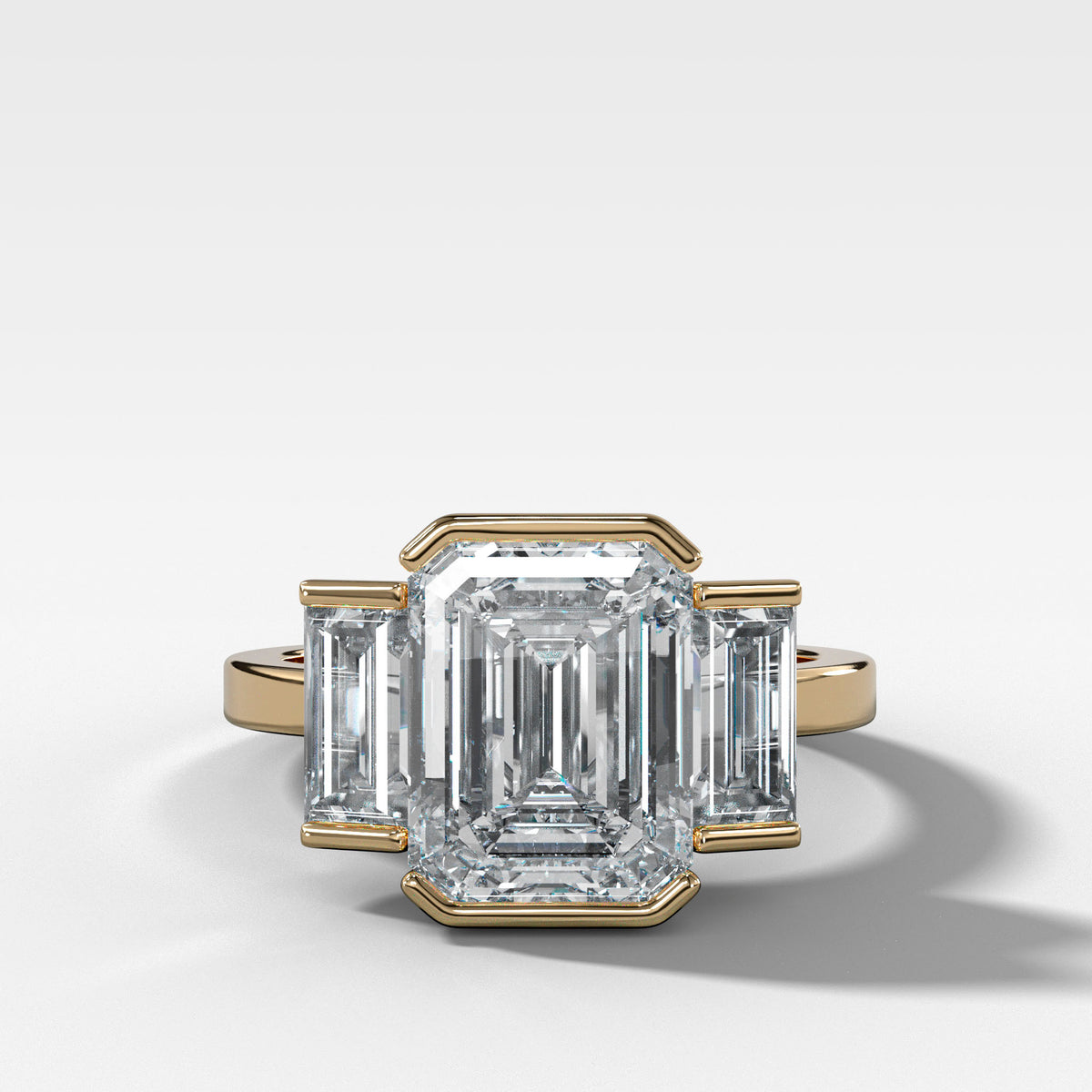 Three Stone Engagement Ring with Half Bezel Baguette Side Stones and Emerald Cut Diamond