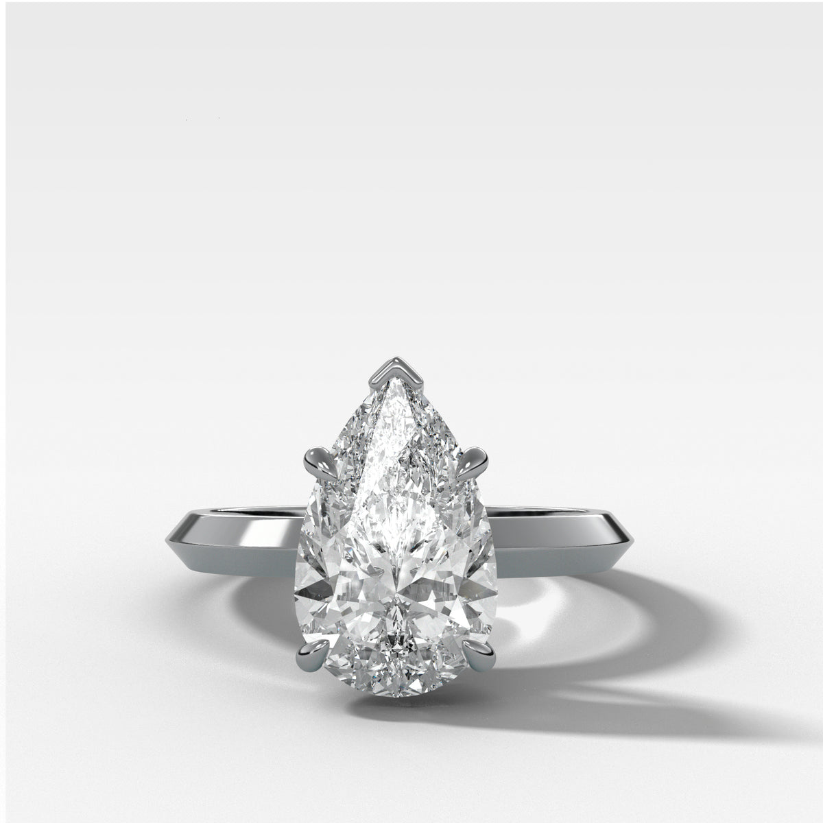 Butter Knife Solitaire Engagement Ring With Pear Cut Diamond