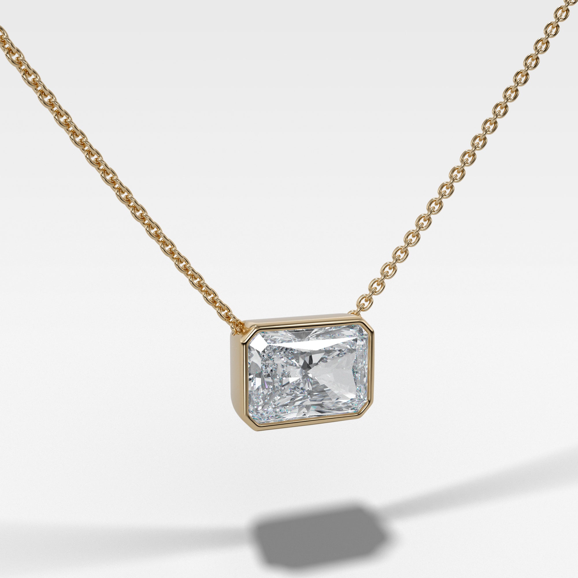 Bezel Pendant Necklace with Elongated Radiant Cut Diamond