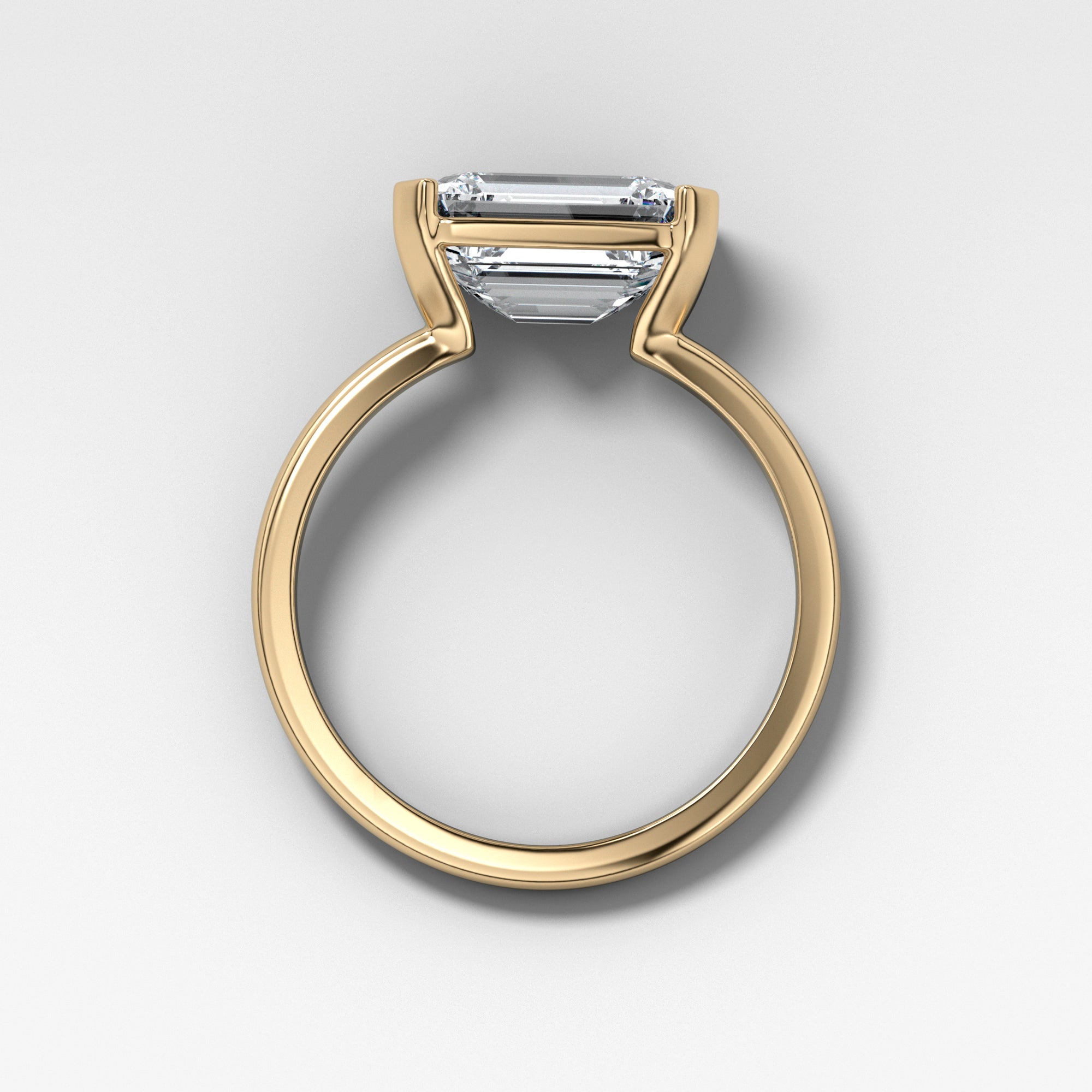 East West Half Bezel Solitaire Engagement Ring With Emerald Cut by Good Stone in Yellow Gold