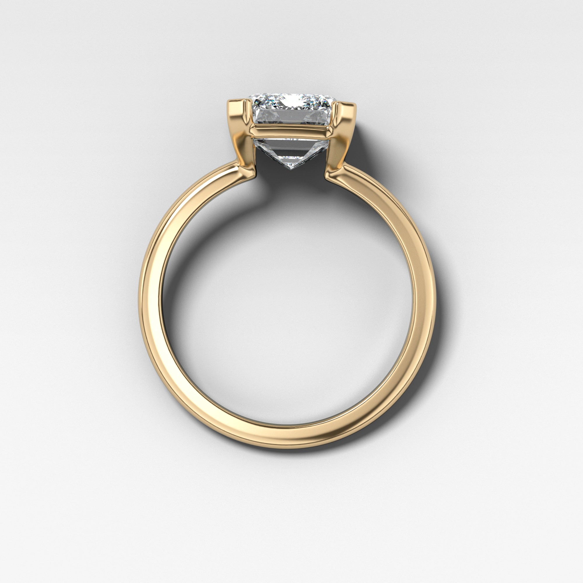 North South Half Bezel Solitaire Engagement Ring With Emerald Cut by Good Stone in Yellow Gold