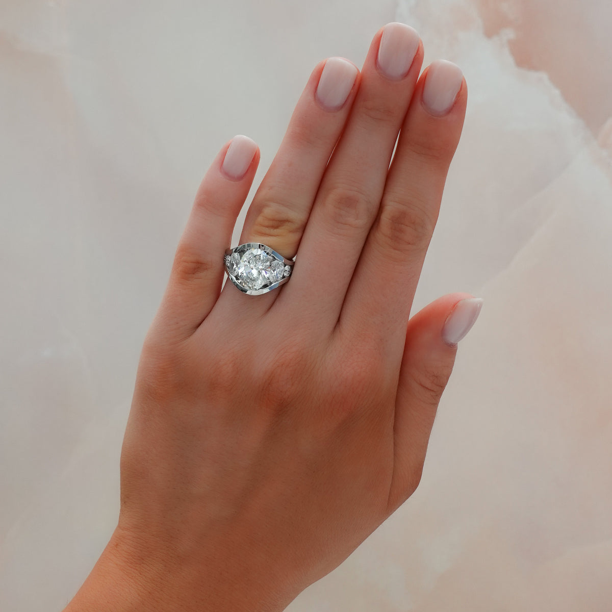 Full Channel Set Engagement Ring with Oval and Round Diamonds