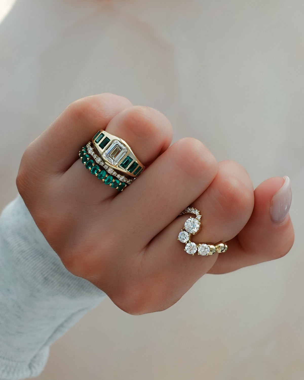 Brick Road Engagement Ring with Green Emeralds and an Emerald Cut