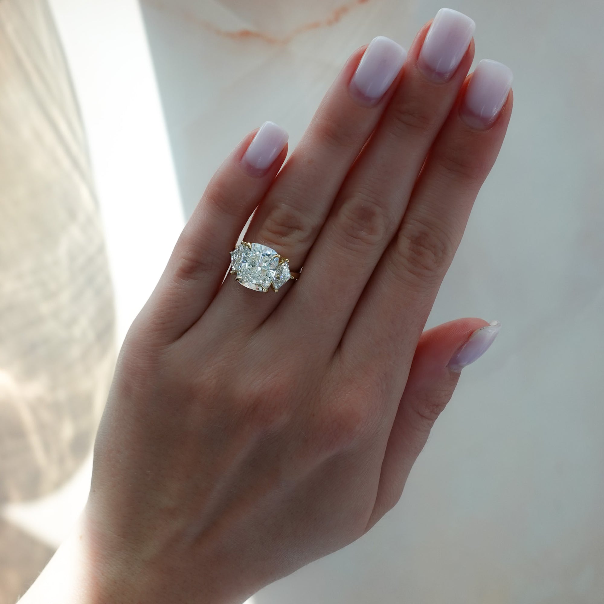 Three Stone ring with Shield Side Stones and an Elongated Cushion cut Engagement Good Stone Inc 