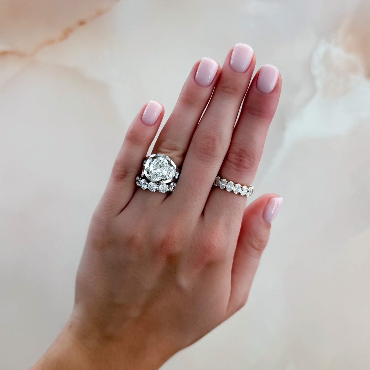 Full Channel Set Engagement Ring with Oval and Round Diamonds