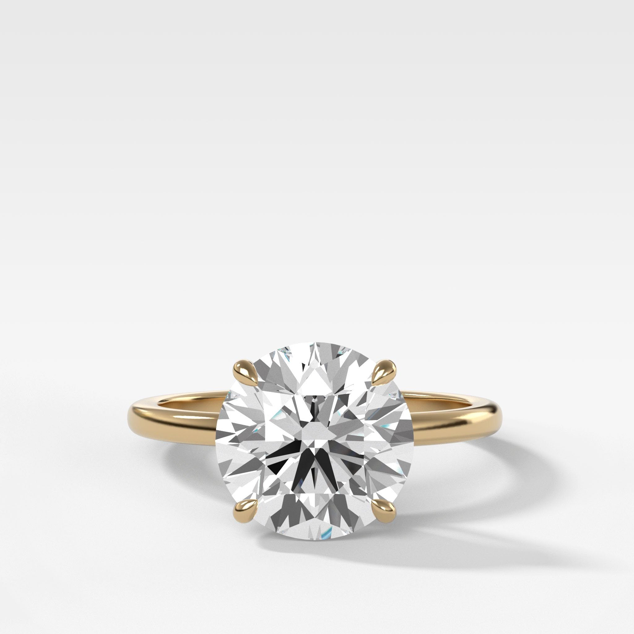 Crescent Solitaire With Round Cut by Good Stone in Yellow Gold