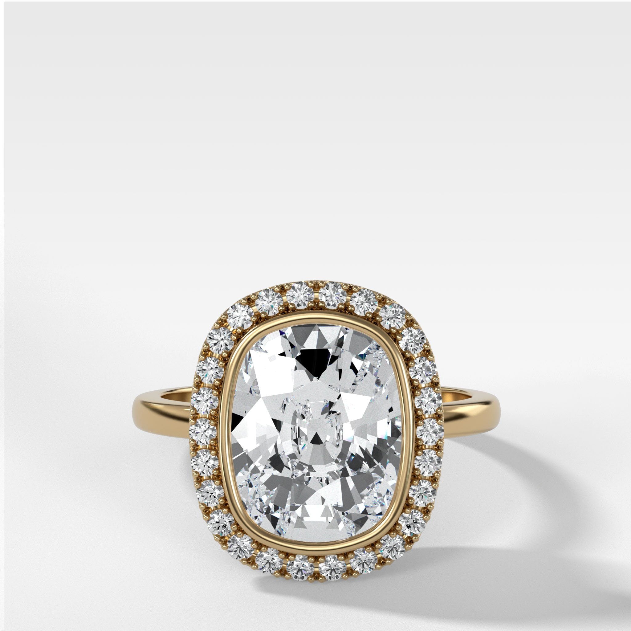 Bezel Set Halo Engagement Ring With Elongated Cushion Cut by Good Stone in Yellow Gold