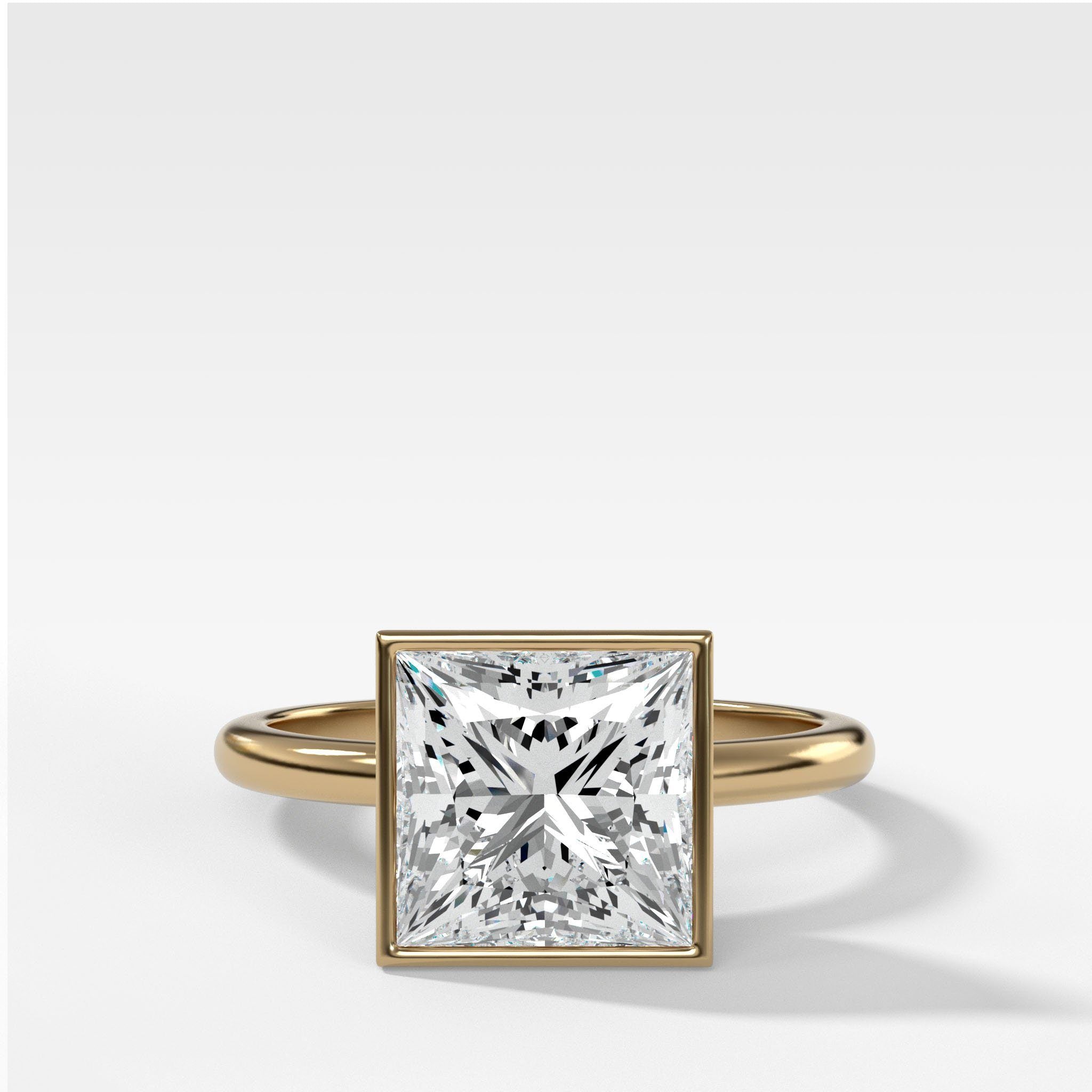 Bezel Penumbra Solitaire With Princess by Good Stone in Yellow Gold