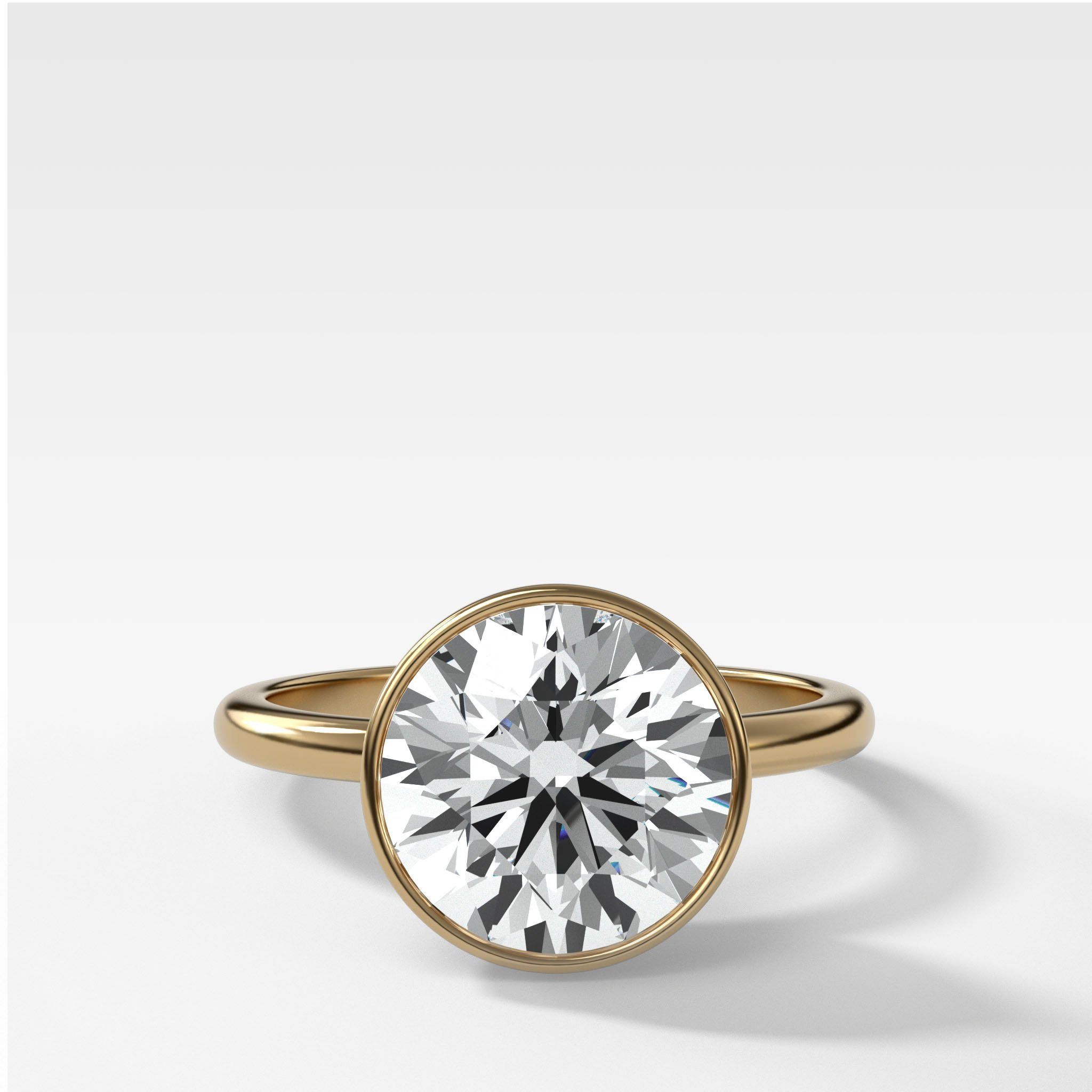 Bezel Penumbra Solitaire With Round Cut by Good Stone in Yellow Gold