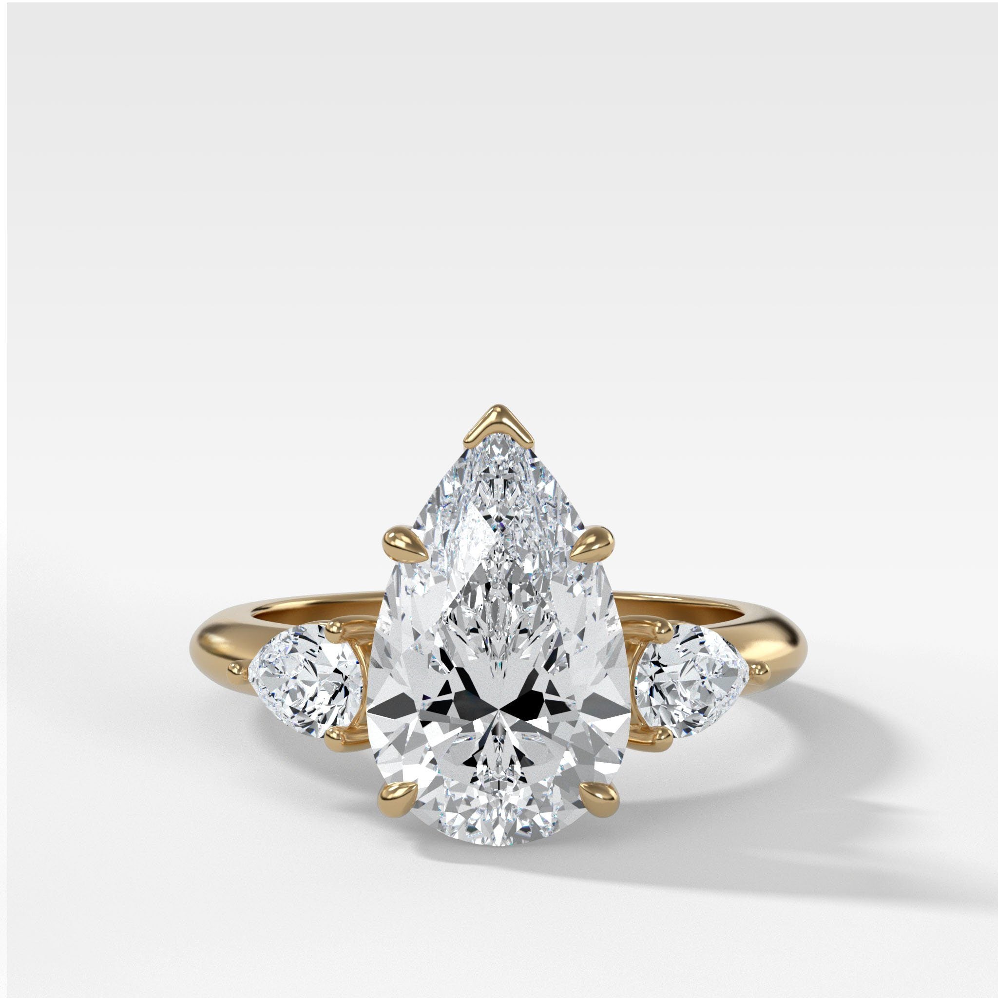 Three Stone Engagement Ring With Pear Side Stones and Pear Cut by Good Stone in Yellow Gold